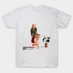 girl sitting on a chair T-Shirt